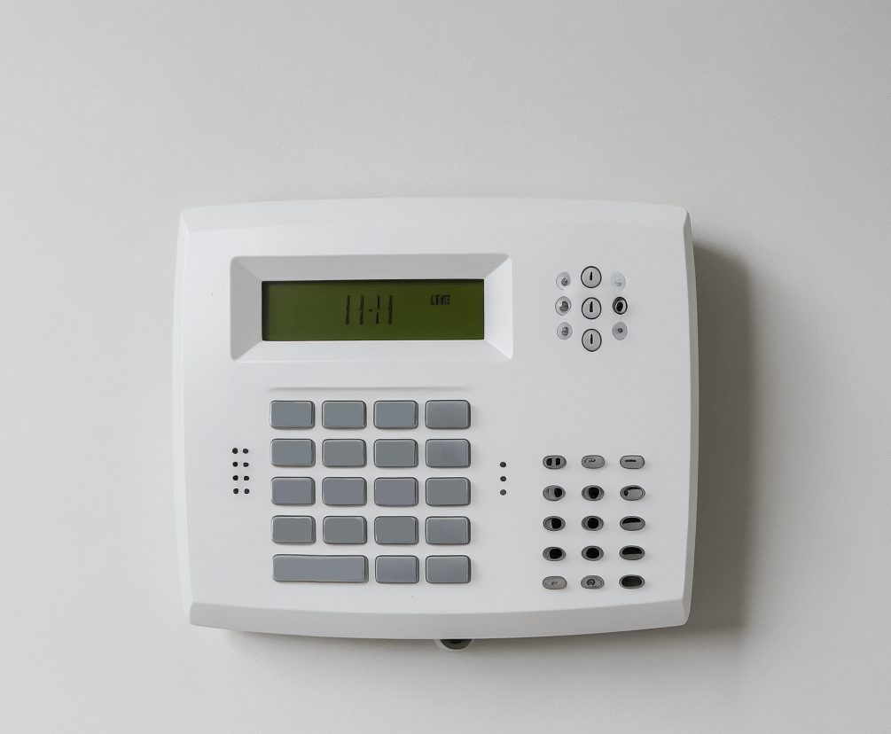 Unbranded intruder alarm on white wall